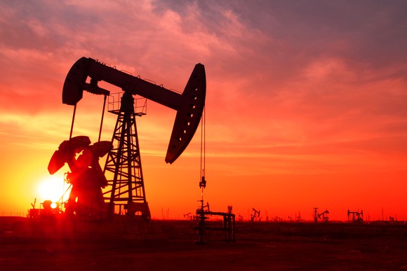 a-silhouette-of-an-oil-pump-in-an-oil-field-at-sunset_large.jpg